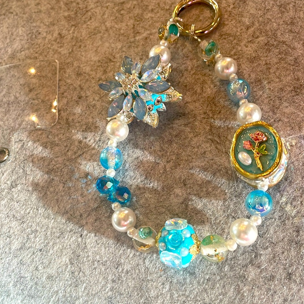NEW Wristlet phone accessory with beads in varying blues